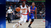 Dennis Schroder #17 of the Atlanta Hawks drives against Ish Smith #14 of the Detroit Pistons at Philips Arena on October 13, 2016 in Atlanta, Georgia. (Photo by Kevin C. Cox/Getty Images)