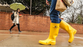 Scattered showers will linger through Sunday afternoon